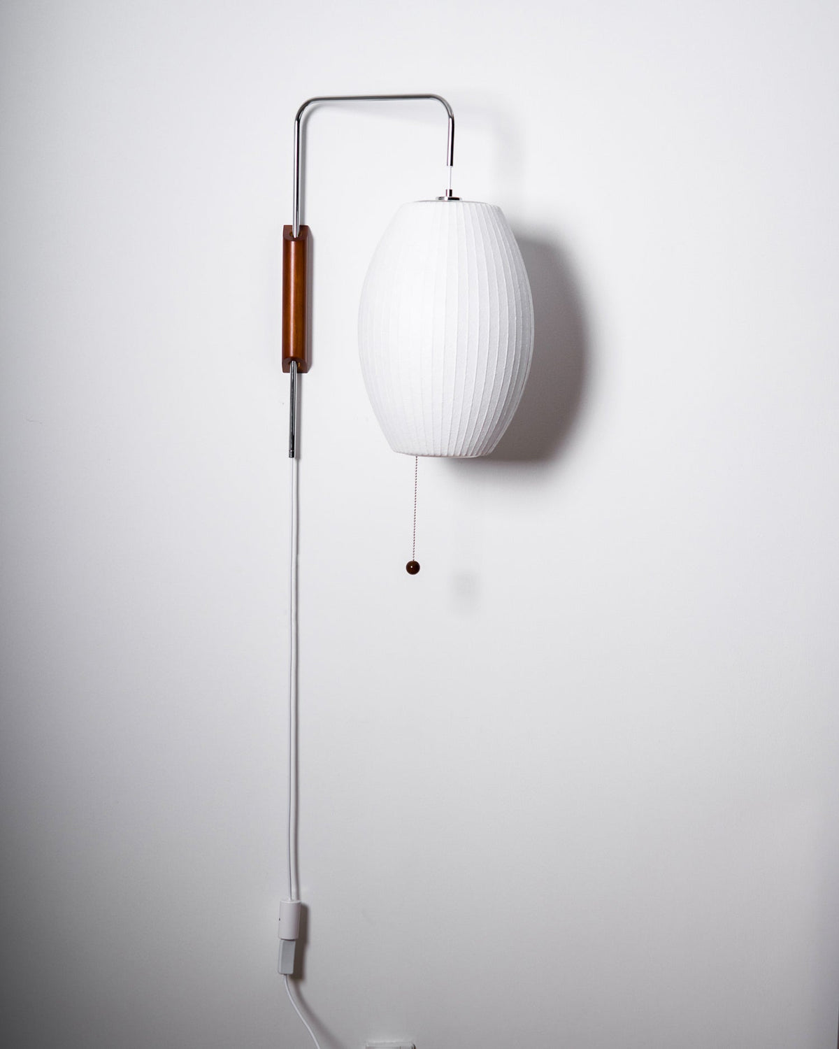 Mid-Century Walnut Bubble Sconce – Swivel Plug-In