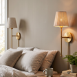 Tropical Gold Palm Wall Sconce in a styled room setting